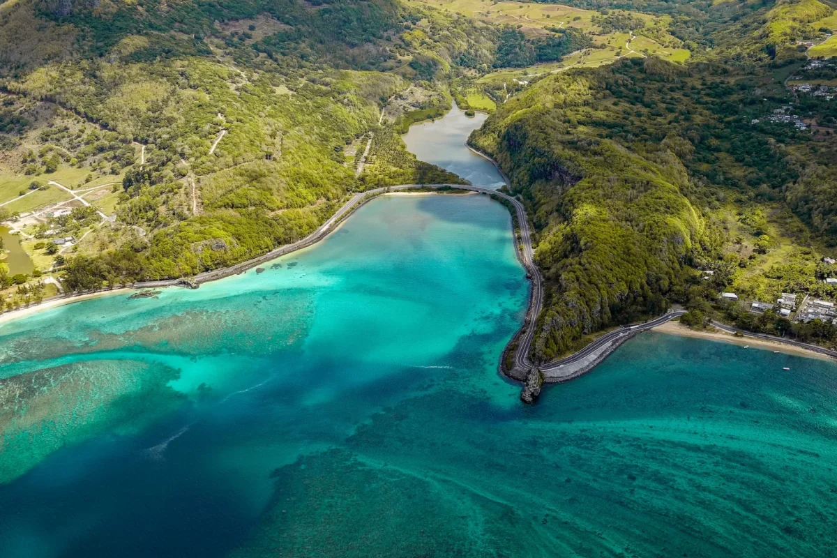The coastal road curving along the shoreline at Baie du Cap in southern Mauritius