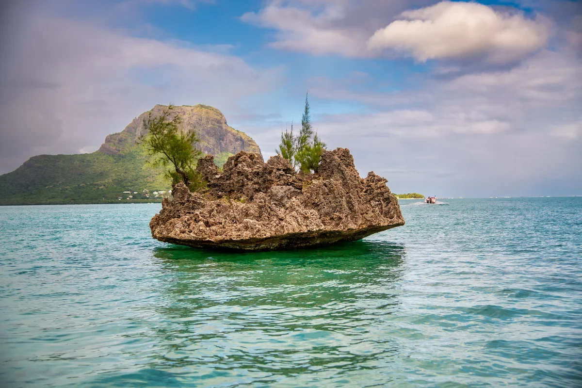 Crystal Rock standing alone in the turquoise lagoon off the west coast of Mauritius