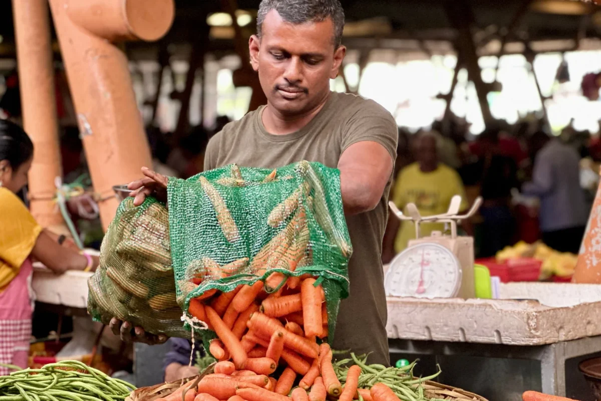 Farmers selling produce at the Flacq market in eastern Mauritius