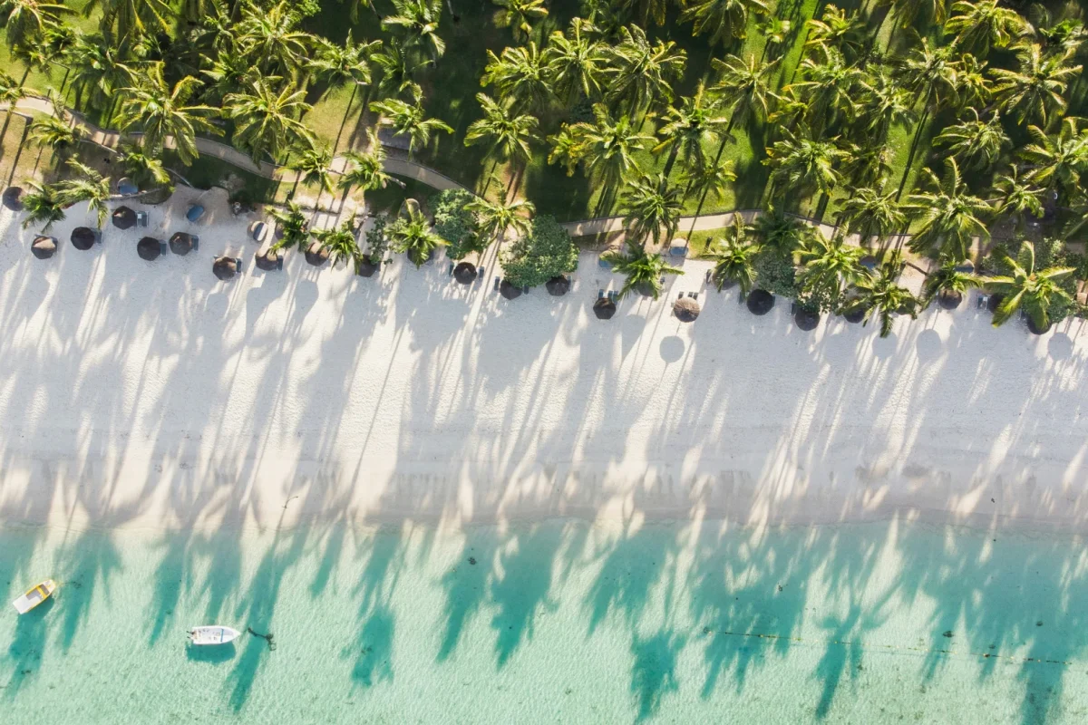 The long white sweep of Flic-en-Flac beach on the west coast of Mauritius