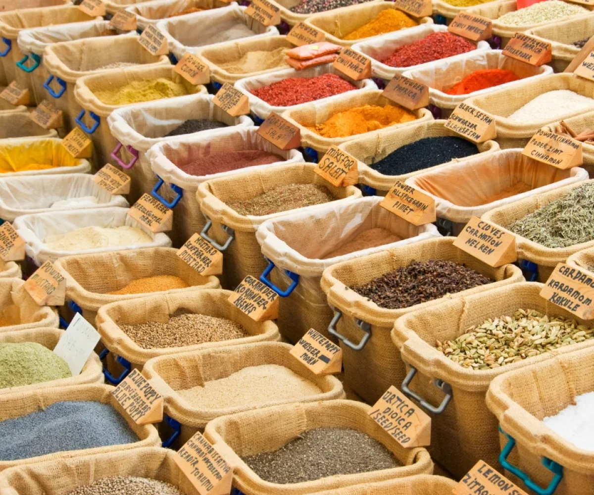 Spice stalls piled with chillies, turmeric and masalas at the Port Louis central market