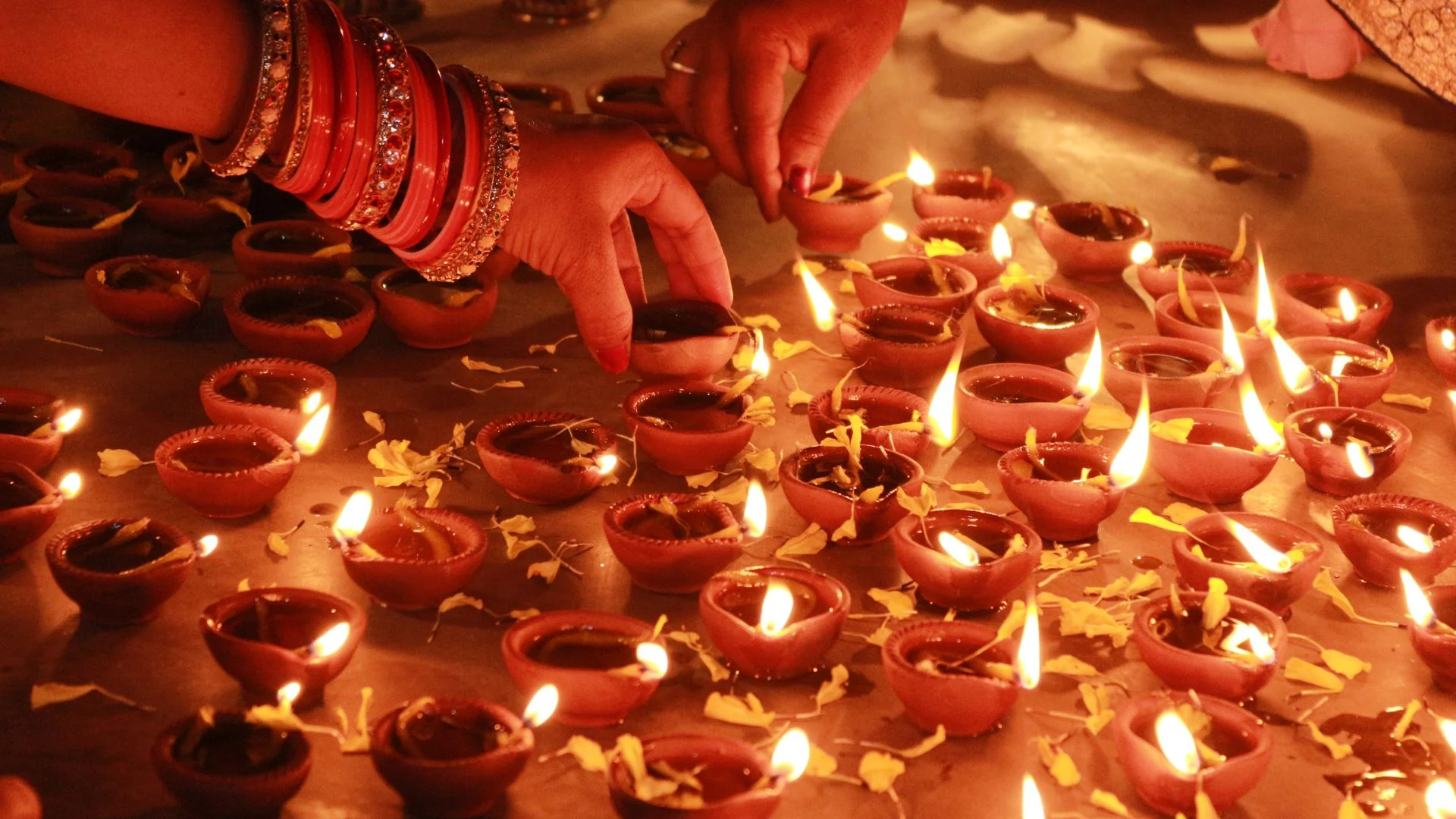 Rows of clay diyas lit for Diwali, the festival of lights, in Mauritius