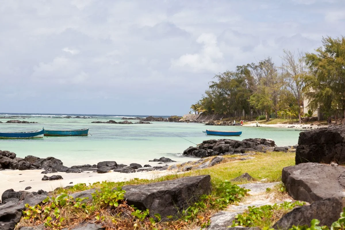 The quiet sand and turquoise lagoon at Palmar beach on the east coast of Mauritius